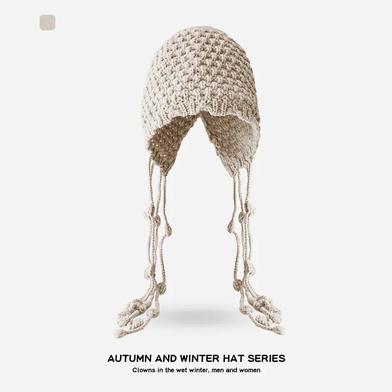Autumn and Winter Warm Wool Hat Hand-woven Hollow Bag Hat Women's Ethnic Style Fringed Ear Protector Knitted Hat