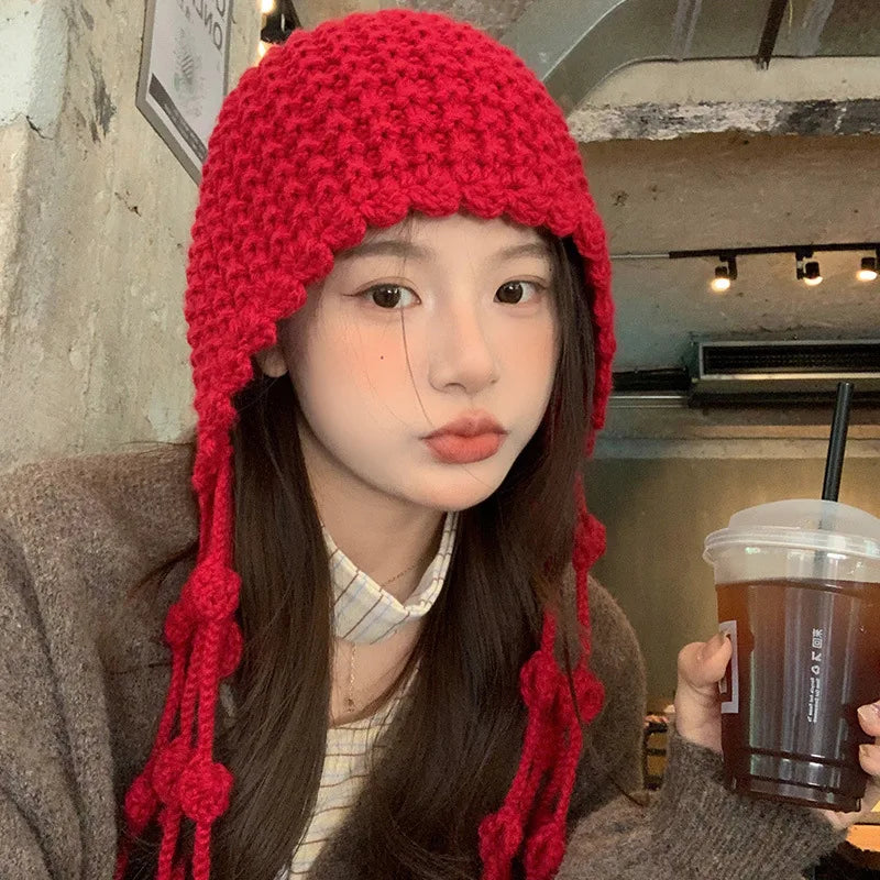 Autumn and Winter Warm Wool Hat Hand-woven Hollow Bag Hat Women's Ethnic Style Fringed Ear Protector Knitted Hat